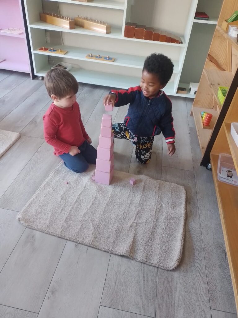 boys doing pink tower